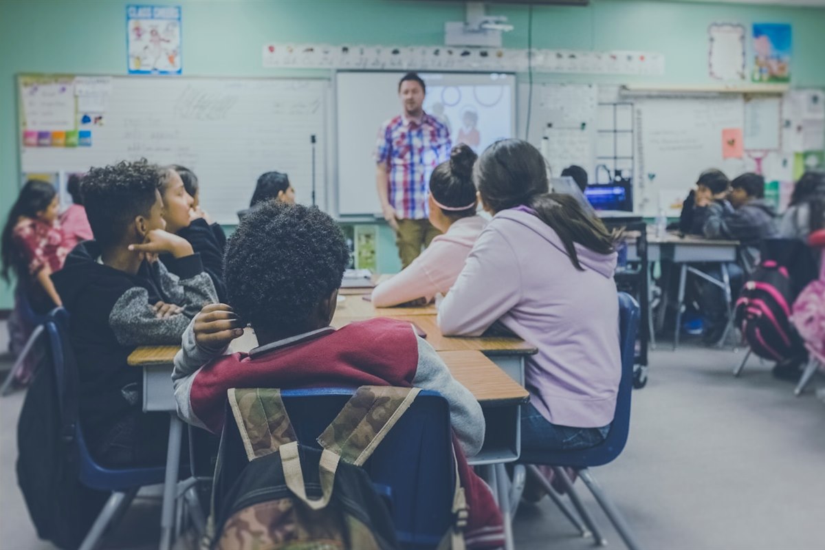 Children reading and receiving tutoring support